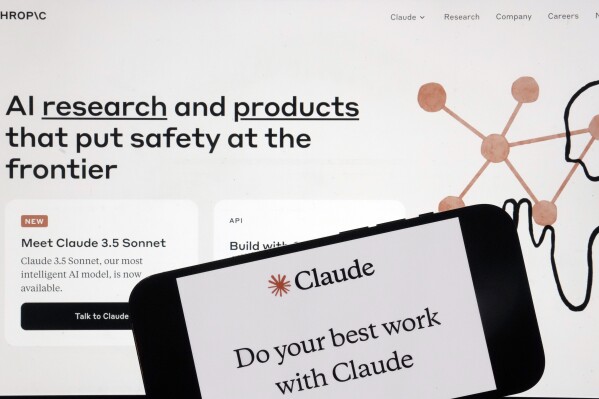 FILE - The Anthropic website and mobile phone app are shown in this photo, in New York, Friday, July 5, 2024. Britain's competition watchdog said Tuesday, July 30, 2024, it's looking into Google's partnership with artificial intelligence startup Anthropic, adding fresh regulatory scrutiny for the investment flooding into the AI industry. (AP Photo/Richard Drew, File)