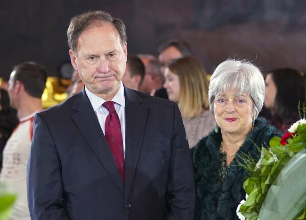 FILE - Supreme Court Justice Samuel Alito Jr., left, and his wife Martha-Ann Alito, pay their respects at the casket of Reverend Billy Graham at the Rotunda of the U.S. Capitol Building in Washington, Feb. 28, 2018. (AP Photo/Pablo Martinez Monsivais, File)