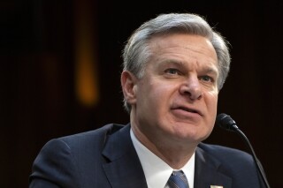 FBI Director Christopher Wray speaks during a hearing of the Senate Intelligence Committee on Capitol Hill, March 11, 2024, in Washington. Eight individuals from Tajikistan with suspected ties to the Islamic State have been arrested in the United States in recent days. (AP Photo/Mark Schiefelbein, File)