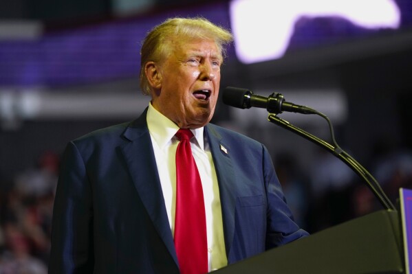 FILE - Republican presidential candidate former President Donald Trump speaks at a campaign rally, June 22, 2024, at Temple University in Philadelphia. The federal judge presiding over Trump's classified documents prosecution is hearing arguments Monday, June 24, on whether to bar him from public comments that prosecutors say could endanger the lives of FBI agents working on the case. Special counsel Jack Smith's team says the restrictions are necessary in light of Trump's false comments that the FBI agents who searched his Mar-a-Lago estate for classified documents were out to kill him and his family. (AP Photo/Chris Szagola, File)