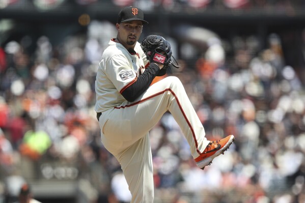 San Francisco Giants pitcher Blake Snell throws to a Minnesota Twins batter during the first inning of a baseball game in San Francisco, Sunday, July 14, 2024. (AP Photo/Kavin Mistry)