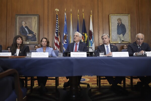 Attorney General Merrick Garland, center, speaks before a meeting of the Justice Department's Election Threats Task Force, at the Department of Justice, Wednesday, Sept. 4, 2024, in Washington, with from left, Deputy Attorney General, Criminal Division, Nicole Argentieri, Deputy Attorney General Lisa Monaco, Garland, FBI Director Christopher Wray and Assistant Attorney General, National Security Division, Matthew Olsen. (AP Photo/Mark Schiefelbein)