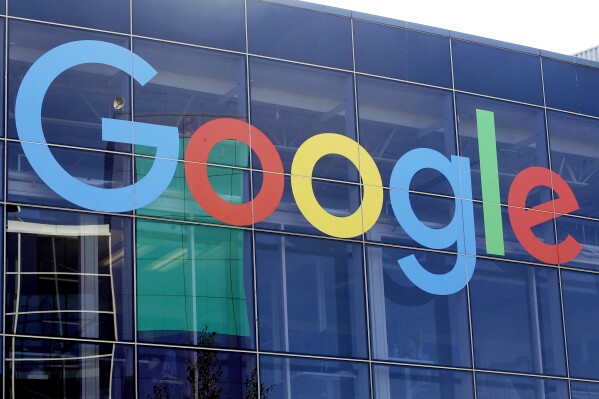 FILE - A sign is shown on a Google building at their campus in Mountain View, Calif., on Sept. 24, 2019. On Friday, June 7, 2024, U.S. District Judge Leonie Brinkema ruled that a judge rather than a jury will decide whether Google violated federal antitrust laws by building a monopoly on the technology that powers online advertising. (AP Photo/Jeff Chiu, File)