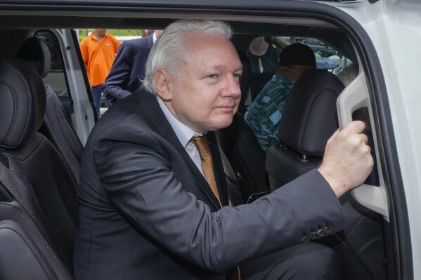 WikiLeaks founder Julian Assange leaves the federal court in Saipan, Mariana Islands, Wednesday, June 26 2024. (AP Photo/Eugene Hoshiko)