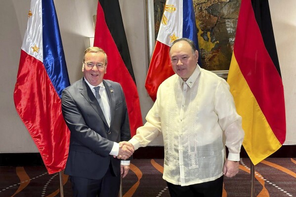 German Defense Minister Boris Pistorius, left, meets with his Philippine counterpart Gilberto Teodoro, Jr. in Manila, Philippines, Sunday, Aug. 4, 2024. (AP Photo/Joeal Calupitan)