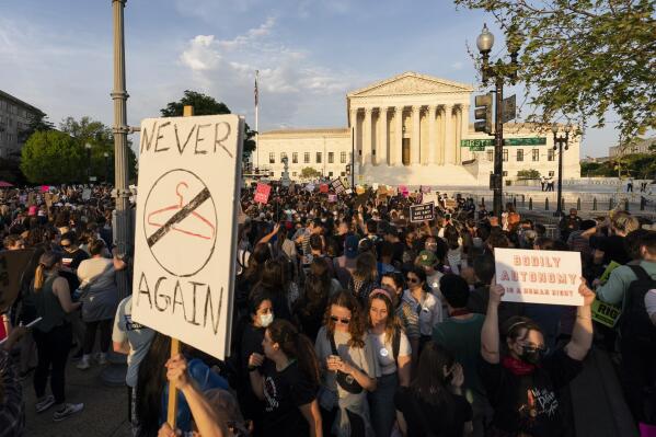 FILE - Demonstrators protest outside of the U.S. Supreme Court, May 3, 2022 in Washington, following news report by Politico that a draft opinion suggests the justices could be poised to overturn the landmark 1973 Roe v. Wade case that legalized abortion nationwide. (AP Photo/Alex Brandon, File)