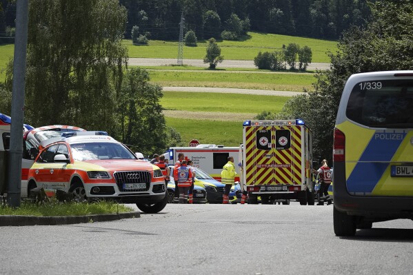 Emergency services and police at the scene of an incident, in Albstadt-Lautlingen, Baden-Württemberg, Germany, Sunday, July 14, 2024. German police says that a shooting within a family in southwestern Germany leaves three dead and two wounded. Police was called to the scene in the town of Albstadt which is located halfway between Stuttgart and Lake Constance shortly after noon local time on Sunday, police spokesperson Ramona Döttling told the Associated Press. (Jannik Nölke/dpa via AP)
