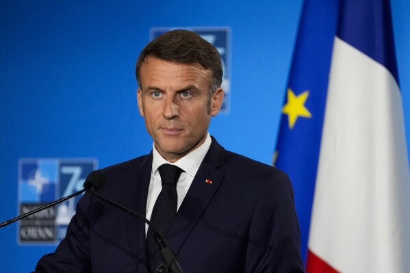 French President Emmanuel Macron speaks during a news conference, Thursday, July 11, 2024, during the NATO summit in Washington. (AP Photo/Stephanie Scarbrough)