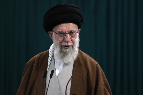 FILE - Iranian Supreme Leader Ayatollah Ali Khamenei speaks with media members after he voted for the parliamentary runoff elections, in Tehran, Iran, Friday, May 10, 2024. (AP Photo/Vahid Salemi, File)