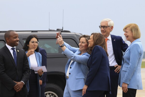 Vice President Kamala Harris poses for a selfie with Wisconsin Lt. Gov. Sara Rodriguez and Sen. Tammy Baldwin, D-Wisc., as she arrives in Milwaukee, Wisc., Tuesday, July 23, 2024.  (Kevin Mohatt/Pool via AP)