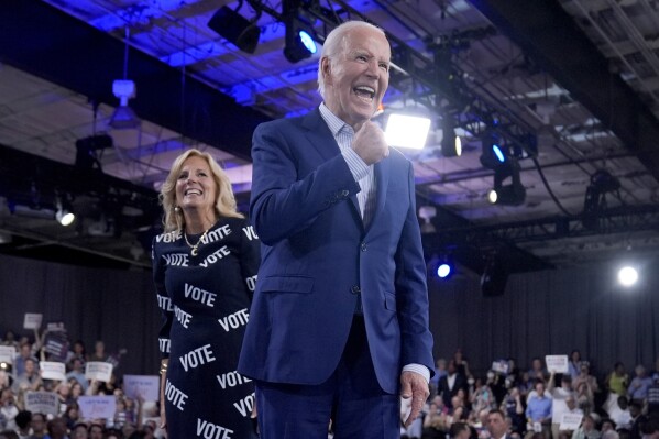 President Joe Biden, right, and first lady Jill Biden walk off stage after speaking at a campaign rally, Friday, June 28, 2024, in Raleigh, N.C. (AP Photo/Evan Vucci)