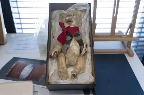 A teddy bear is displayed in a textiles conservation lab during the inauguration of The Moshal Shoah Legacy Campus and The David and Fela Shapell Family Collections Center, at Yad Vashem World Holocaust Remembrance Center in Jerusalem, Monday, July 8, 2024. Israel's national Holocaust museum opened a new conservation facility in Jerusalem, which will preserve, restore, and store the more than 45,000 artifacts and works of art in a vast new building, including five floors of underground storage. (AP Photo/Maya Alleruzzo)