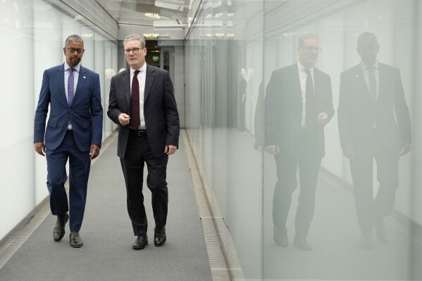 Britain's Prime Minister Keir Starmer, right, and First Minister of Wales Vaughan Gething walk through the Senedd as part of a two-day tour of the four nations of the United Kingdom in Cardiff, Wales, Monday, July 8, 2024.(AP Photo/Alastair Grant, Pool)