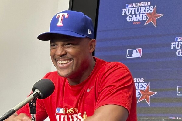 Adrián Beltré speaks to reporters on Saturday, July 13, 2024, before managing in the MLB Futures Game in Arlington, Texas. The former Rangers third baseman is an ambassador for the All-Star Game and will be inducted into baseball's Hall of Fame in Cooperstown, N.Y., on Sunday, July 21. (AP Photo/Stephen Hawkins)