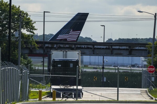 The tail section of former President Trump's airplane is seen on arrival to the Milwaukee Mitchell International Airport where former President Trump will arrive ahead of the 2024 Republican National Convention, Sunday, July 14, 2024, in Milwaukee. (AP Photo/Alex Brandon)