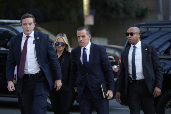 Hunter Biden, center, and his wife Melissa Cohen Biden, arrive in federal court for jury selection for his trial on felony tax charges Thursday, Sept. 5, 2024, in Los Angeles. (AP Photo/Jae C. Hong)