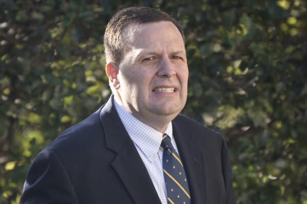 FILE - Former Portage, Ind., Mayor James Snyder arrives to Federal Court in Hammond, Ind., for his sentencing on bribery and tax violation charges, Oct. 13, 2021. The Supreme Court has overturned the bribery conviction of the former Indiana mayor in an opinion that narrows the scope of public corruption law. The high court on Wednesday sided with Snyder, who was convicted of taking $13,000 from a trucking company after prosecutors said he steered about $1 million worth of city contracts their way. Snyder has maintained his innocence, saying the money was payment for consulting work. (Kyle Telechan/Chicago Tribune via AP, File)