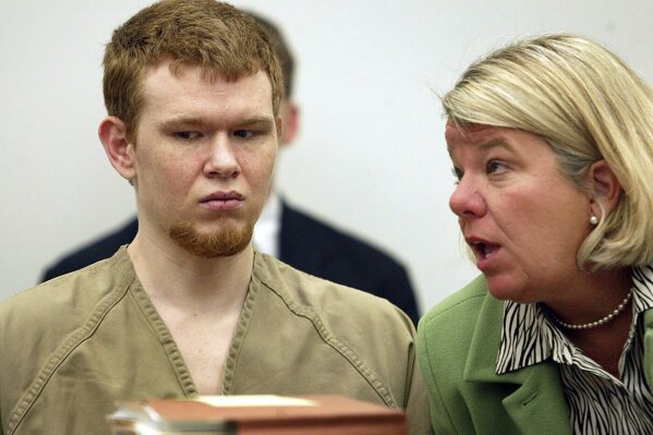 CORRECTS SPELLING TO BEIMDIEK NOT BEIMBIEK FILE - Johnny Johnson, left, listens as his attorney Bevy Beimdiek speaks during his sentencing hearing in St. Louis County Court in Clayton, Mo., March 7, 2005. Johnson who abducted and beat to death a 6-year-old girl was scheduled to be executed on Tuesday, Aug. 1, 2023, in Missouri, as his attorneys pressed claims that he is mentally incompetent. (Gabriel B. Tait/St. Louis Post-Dispatch via AP, File)