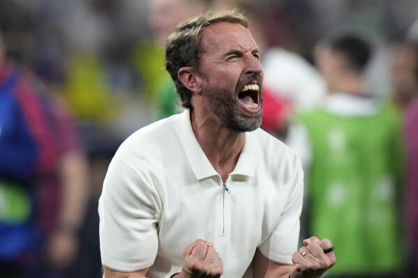 England's manager Gareth Southgate celebrates after winning a semifinal match between the Netherlands and England at the Euro 2024 soccer tournament in Dortmund, Germany, Wednesday, July 10, 2024. (AP Photo/Frank Augstein)