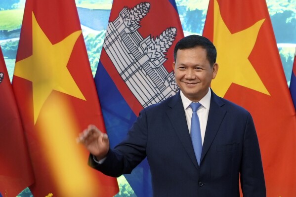 FILE - Cambodian Prime Minister Hun Manet poses for photo, along with Vietnamese Prime Minister Pham Minh Chinh, not in photo, in Hanoi, Vietnam on Monday, Dec.11, 2023. (AP Photo/Hau Dinh, File)