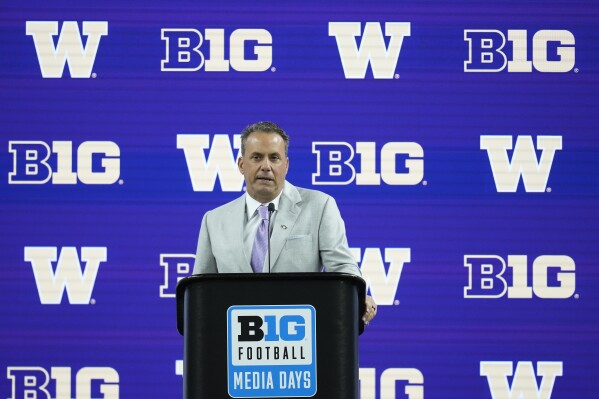 Washington head coach Jedd Fisch speaks during an NCAA college football news conference at the Big Ten Conference media days at Lucas Oil Stadium, Thursday, July 25, 2024, in Indianapolis. (AP Photo/Darron Cummings)