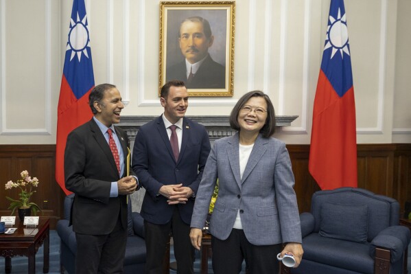 In this photo released by the Taiwan Presidential Office, Taiwan's President Tsai Ing-wen, right, meets with Rep. Mike Gallagher, the Republican chair of the House Select Committee on the Chinese Communist Party, center, and Raja Krishnamoorthi, D.-Ill., in Taipei, Taiwan, Thursday, Feb. 22, 2024. A group of United States Congress members met with Taiwan's president Thursday in a show of support that's certain to draw scrutiny from China, which opposes such visits and sees them as a challenge to its claim of sovereignty over the island. (Taiwan Presidential Office via AP)