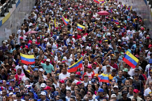 Government supporters rally in defense of President Nicolas Maduro's reelection in Caracas, Venezuela, Tuesday, July 30, 2024, two days after the disputed presidential election. (AP Photo/Fernando Vergara)