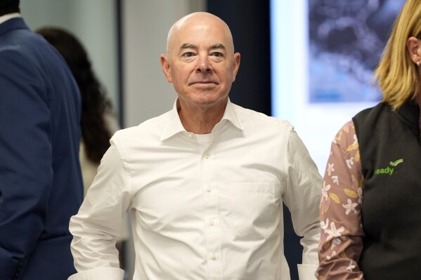 Homeland Security Secretary Alejandro Mayorkas watches during a visit by President Joe Biden to the D.C. Emergency Operations Center, Tuesday, July 2, 2024, in Washington. DHS says it has deported 116 Chinese migrants from the United States in the first "large charter flight" in five years. (AP Photo/Evan Vucci)