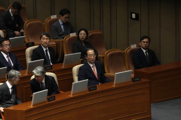 South Korean Prime Minister Han Duck-soo, center right in front, sits during the opening ceremony of the 22nd National Assembly in Seoul, South Korea, Monday, Sept. 2, 2024. (AP Photo/Lee Jin-man)