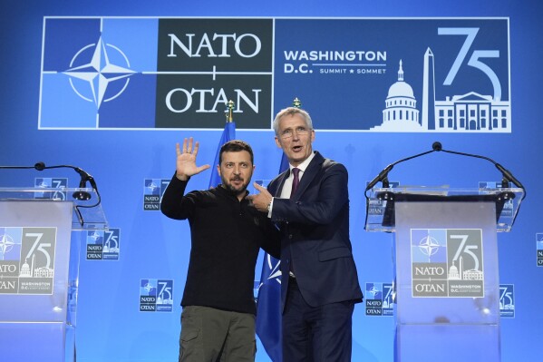 Ukraine's President Volodymyr Zelenskyy and NATO Secretary General Jens Stoltenberg speak during a press conference at the NATO summit in Washington, Thursday, July 11, 2024. (AP Photo/Mark Schiefelbein)