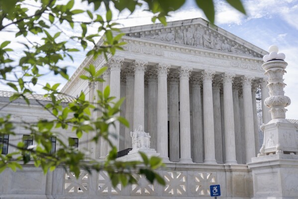 FILE - The Supreme Court building is seen on June 27, 2024, in Washington. Supreme Court justices will take the bench Monday, July 1, to release their last few opinions of the term, including their most closely watched case: whether former President Donald Trump has immunity from criminal prosecution. (AP Photo/Mark Schiefelbein, File)