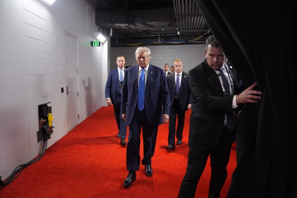 FILE - Republican presidential candidate former President Donald Trump arrives during the second day of the Republican National Convention at the Fiserv Forum, Tuesday, July 16, 2024, in Milwaukee. (AP Photo/Evan Vucci, File)