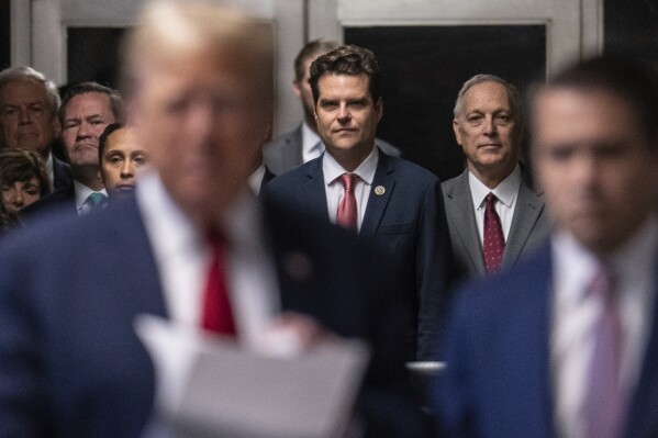 Representative Matt Gaetz, R-Fla., listens as former President Donald Trump talks with the media at Manhattan criminal court in New York, on Thursday, May 16, 2024. (Jeenah Moon/Pool Photo via AP)