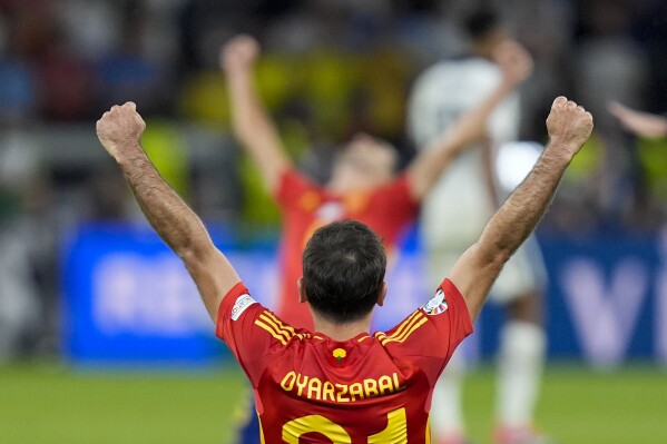 Spain's Mikel Oyarzabal celebrates after winning the final match against England at the Euro 2024 soccer tournament in Berlin, Germany, Sunday, July 14, 2024. (AP Photo/Matthias Schrader)