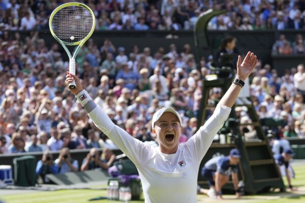 Barbora Krejcikova of the Czech Republic celebrates after defeating Jasmine Paolini of Italy in the women's singles final at the Wimbledon tennis championships in London, Saturday, July 13, 2024. (AP Photo/Kirsty Wigglesworth)