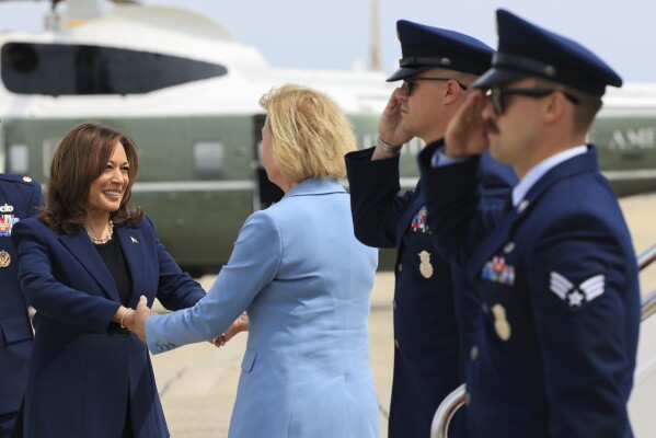 Vice President Kamala Harris is greeted by Sen. Tammy Baldwin, D-Wisc., before boarding Air Force Two to depart on campaign travel to Milwaukee, Wisc., Tuesday, July 23, 2024 at Andrews Air Force Base, Md.  (Kevin Mohatt/Pool via AP)