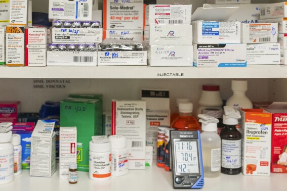 FILE - Temperature and humidity are monitored in a medicine cabinet at a medical center in California on Wednesday, May 29, 2024. Extreme heat can raise the danger of heat-related illnesses and threaten health in a more subtle way — by amplifying the side effects of many common medications. Hot weather, too, can damage medicines such as insulin that require refrigeration. Inhalers can explode. Epinephrine injectors such as EpiPens can malfunction. Meds delivered in the mail can deteriorate. (AP Photo/Nic Coury, File)