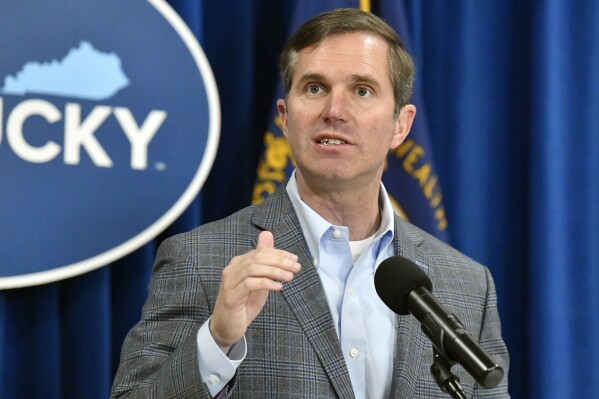 FILE - Kentucky Gov. Andy Beshear speaks in the Rotunda of the state Capitol, March 26, 2024, in Frankfort, Ky. On Friday, July 12, Beshear took a business trip to Asia to promote the Bluegrass State, amid turmoil over whether President Joe Biden should continue with his bid for a second term. (AP Photo/Timothy D. Easley, File)