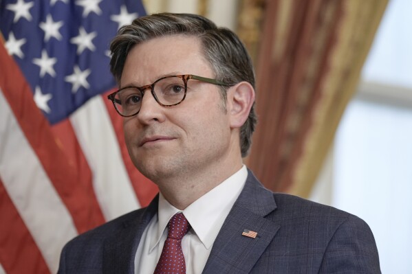 Speaker of the House Mike Johnson, R-La., participates in a ceremonial swearing-in for Rep. Michael Rulli, R-Ohio, on Capitol Hill Tuesday, June 25, 2024, in Washington. (AP Photo/Mariam Zuhaib)