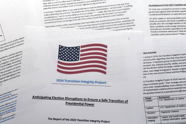 A report released by The Heritage Foundation is photographed Thursday, July 11, 2024. The conservative think tank that is planning for a complete overhaul of the federal government in the event of a Republican presidential win is suggesting that President Joe Biden might try to hold the White House "by force" if he loses the November election. The warning appeared in a report that the group said resulted from a role-playing exercise gaming out potential scenarios before and after the 2024 election. (AP Photo/Jon Elswick)