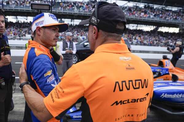 FILE - Kyle Larson, left, talks with Tony Kanaan following the Indianapolis 500 auto race at Indianapolis Motor Speedway, Sunday, May 26, 2024, in Indianapolis. (AP Photo/Darron Cummings, File)