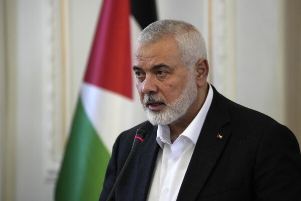 Hamas chief Ismail Haniyeh speaks during a press briefing after his meeting with Iranian Foreign Minister Hossein Amirabdollahian in Tehran, Iran, on March 26, 2024. (AP Photo/Vahid Salemi, File)