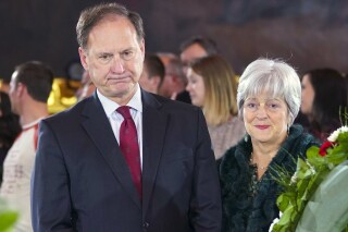 FILE - Supreme Court Justice Samuel Alito Jr., left, and his wife Martha-Ann Alito, pay their respects at the casket of Reverend Billy Graham at the Rotunda of the U.S. Capitol Building in Washington, Feb. 28, 2018. (AP Photo/Pablo Martinez Monsivais, File)