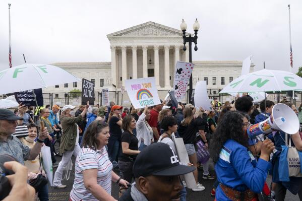 Abortion-rights demonstrators coming from the Washington Monument march past the Supreme Court in Washington, Saturday, May 14, 2022. (AP Photo/Jacquelyn Martin)