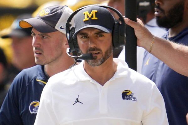 FILE - Michigan head coach defensive coordinator Jesse Minter watches against East Carolina in the first half of an NCAA college football game in Ann Arbor, Mich., Saturday, Sept. 2, 2023. (AP Photo/Paul Sancya, File)
