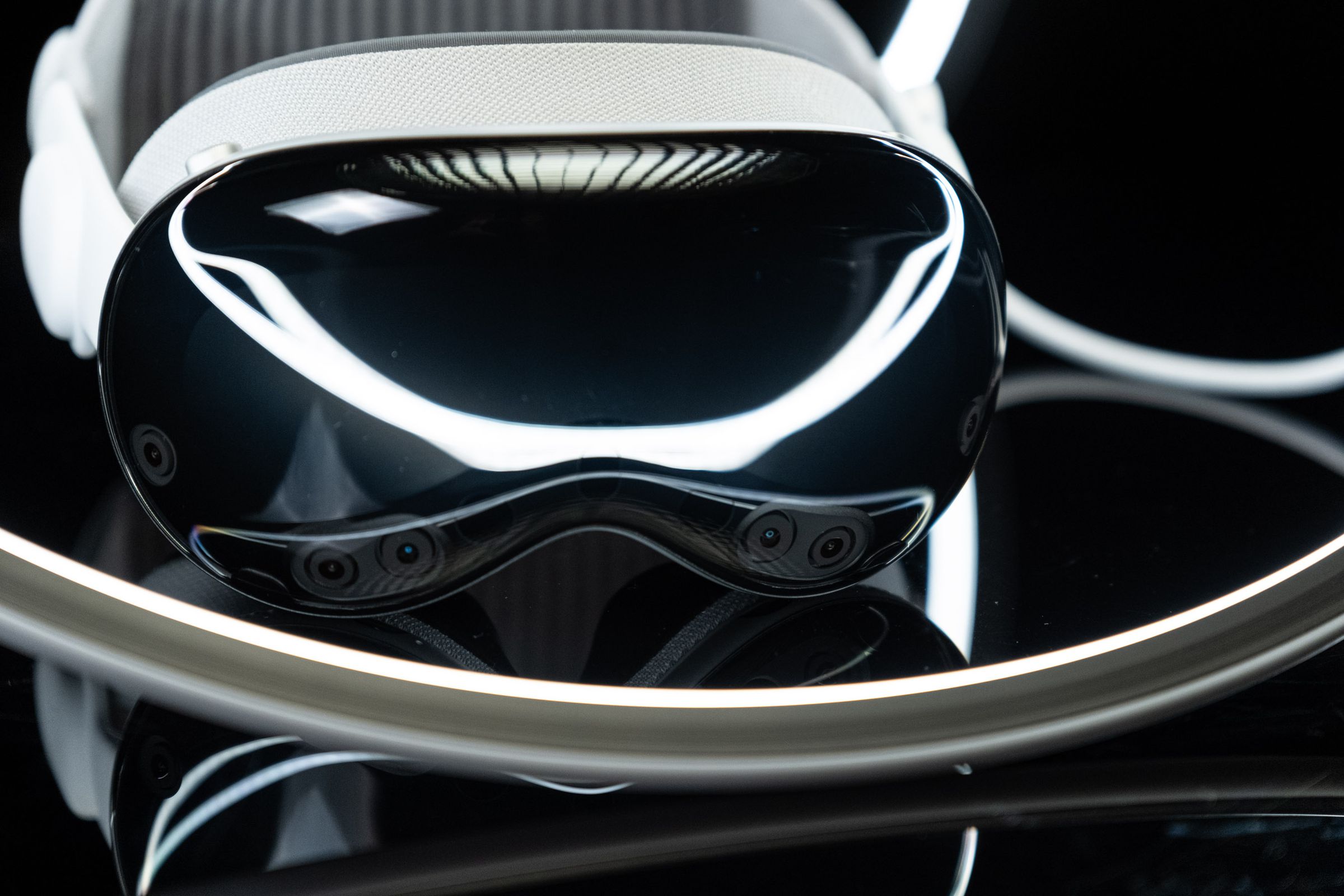 The Vision Pro headset, photographed so that you can see the cameras on the front.