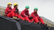 Greenpeace activists on the roof of Prime Minister Rishi Sunak's house in Richmond, North Yorkshire after covering it in black fabric in protest at his backing for expansion of North Sea oil and gas drilling. Picture date: Thursday August 3, 2023.