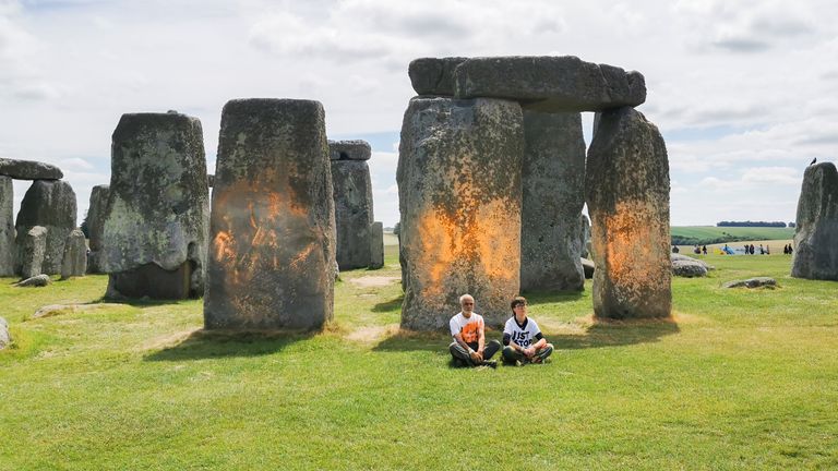 Just Stop Oil protesters spraying an orange substance on Stonehenge.
Pic: Just Stop Oil