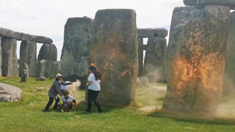 Screen grab taken from handout video of Just Stop Oil protesters spraying an orange substance on Stonehenge. Picture date: Wednesday June 19, 2024.
