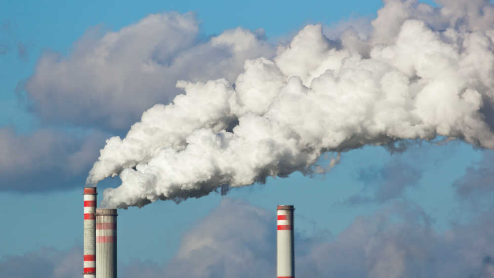 smoke leaving in a factory chimney